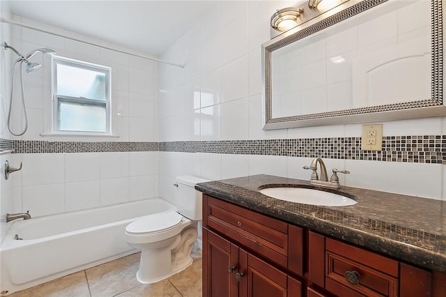 bathroom featuring toilet, tile walls, tile patterned flooring, bathing tub / shower combination, and vanity