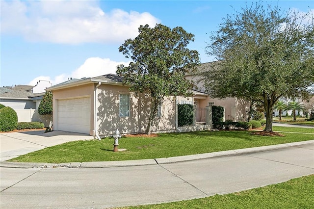 view of front facade with a garage and a front yard