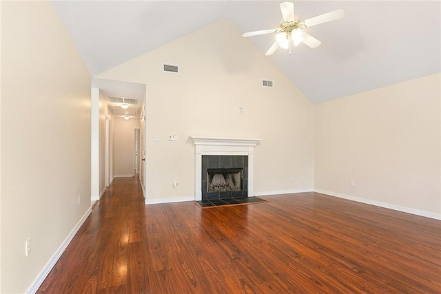 unfurnished living room with ceiling fan, high vaulted ceiling, dark wood-type flooring, and a fireplace