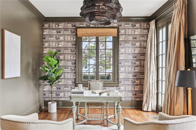 interior space featuring crown molding, wood-type flooring, and a wealth of natural light