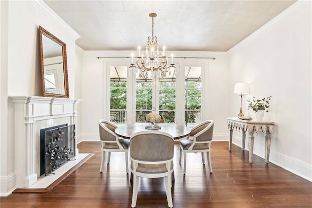 dining space with a healthy amount of sunlight, a notable chandelier, and dark hardwood / wood-style flooring