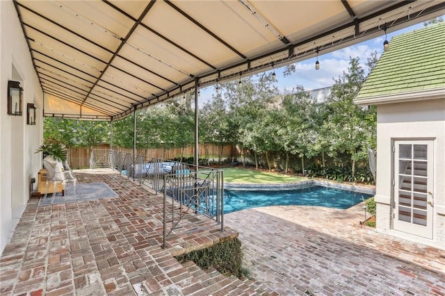 view of swimming pool with a patio area