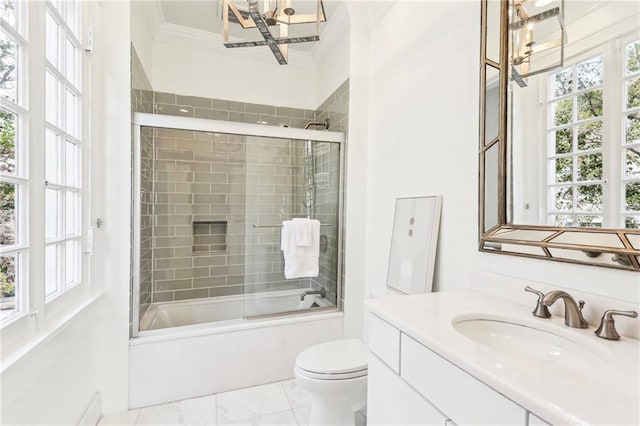 full bathroom with crown molding, combined bath / shower with glass door, vanity, toilet, and a chandelier