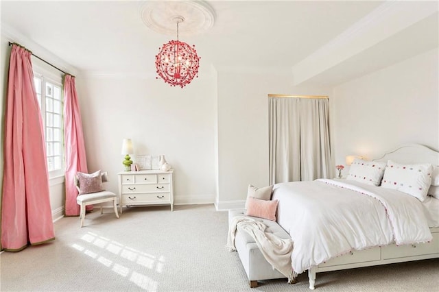 carpeted bedroom with an inviting chandelier