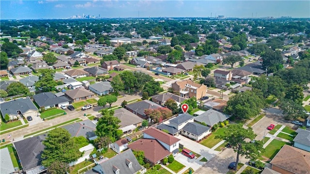 birds eye view of property with a residential view