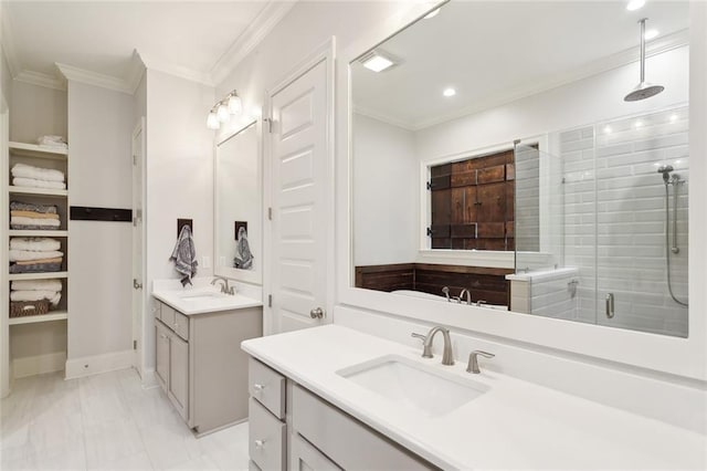 bathroom featuring vanity, ornamental molding, and separate shower and tub