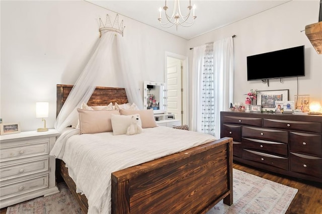 bedroom featuring dark hardwood / wood-style floors and a notable chandelier