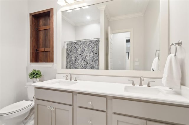 bathroom with crown molding, vanity, toilet, and walk in shower