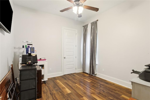 interior space with dark wood-type flooring and ceiling fan