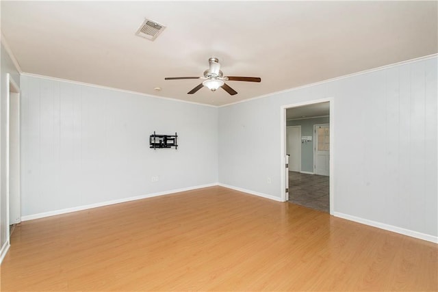 unfurnished room with ceiling fan, ornamental molding, and hardwood / wood-style floors