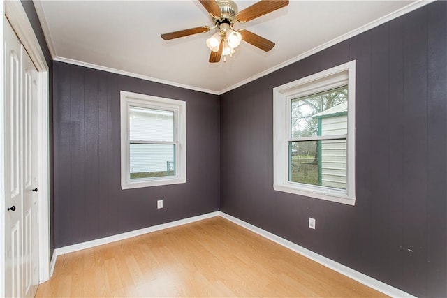 unfurnished room featuring crown molding, ceiling fan, and light hardwood / wood-style floors