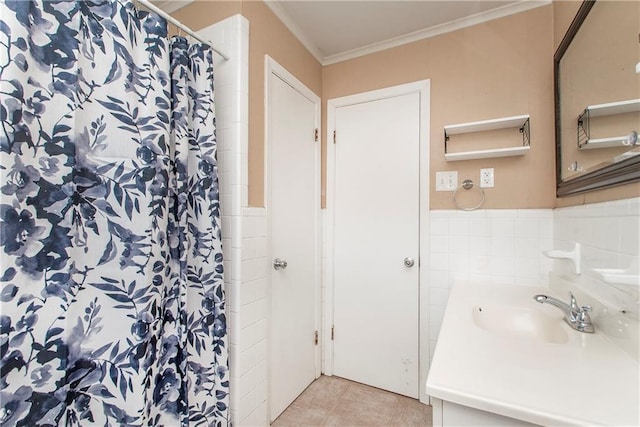 bathroom with tile walls, vanity, crown molding, tile patterned floors, and a shower with curtain