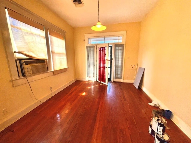 interior space featuring wood-type flooring and cooling unit