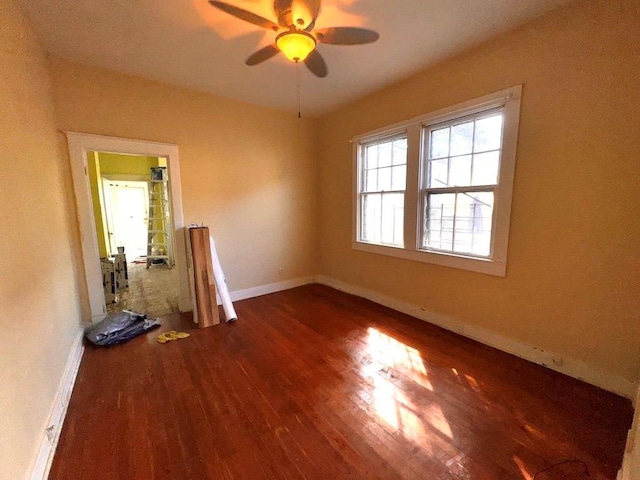 unfurnished room with hardwood / wood-style flooring and ceiling fan