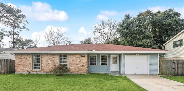 ranch-style home with a garage and a front yard