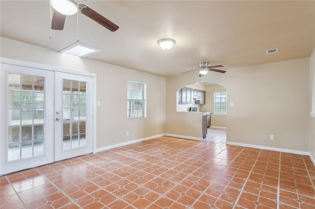 spare room with french doors and ceiling fan