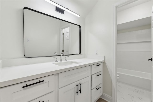 full bathroom with bathtub / shower combination, vanity, and toilet