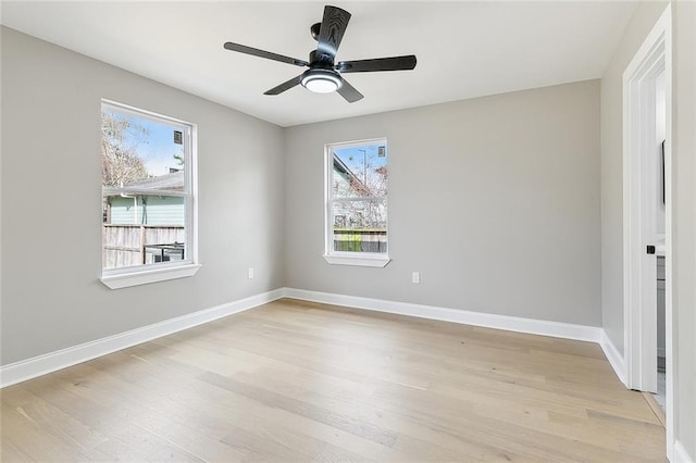 spare room featuring ceiling fan and light wood-type flooring