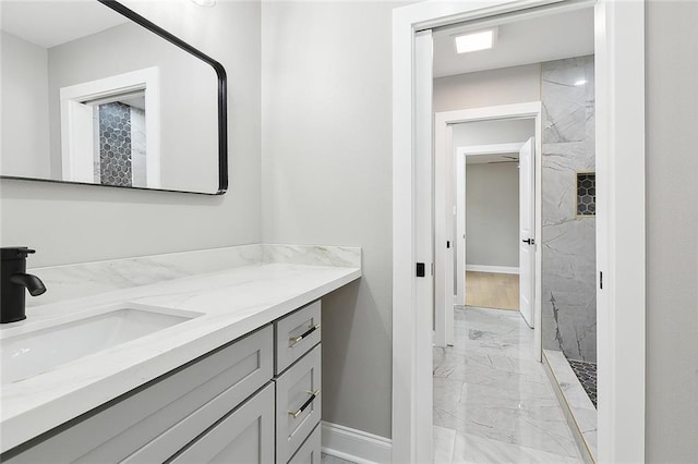 bathroom with vanity and a shower