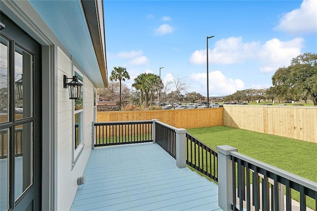 wooden terrace with a yard