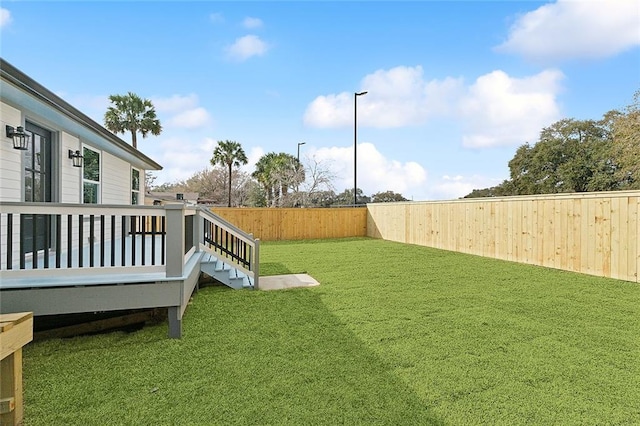 view of yard with a deck