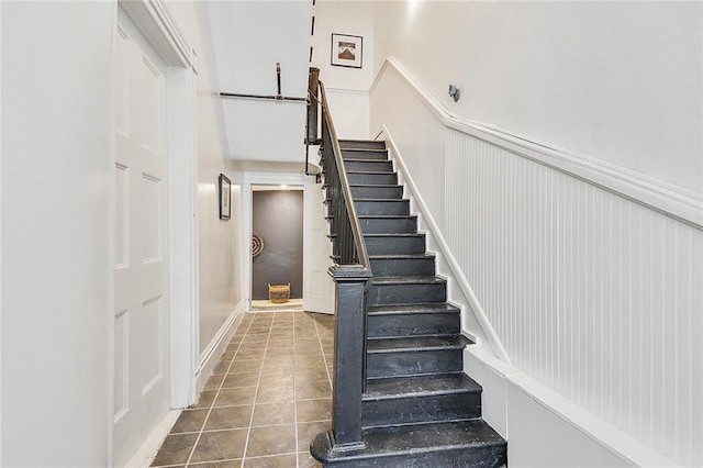 stairs with tile patterned floors