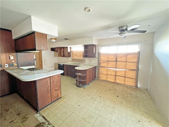 kitchen featuring ceiling fan and kitchen peninsula