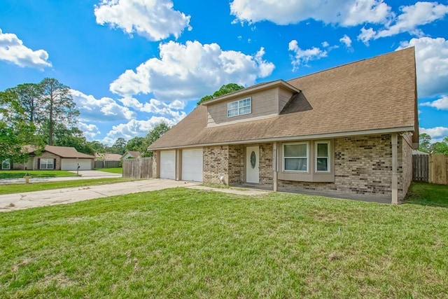 view of front facade with a garage and a front yard