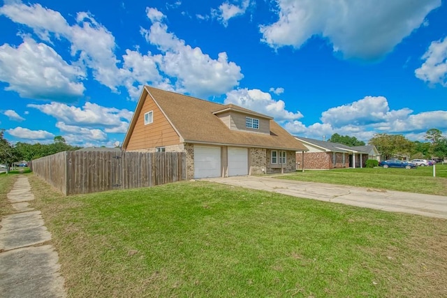 view of front facade featuring a garage and a front lawn