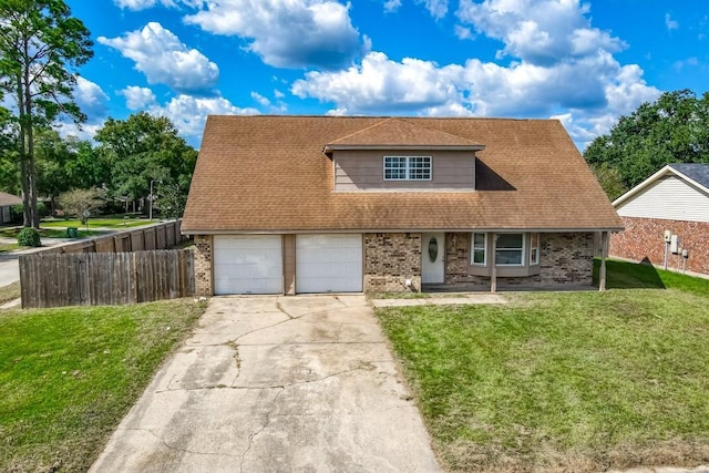 view of front of property with a garage and a front yard