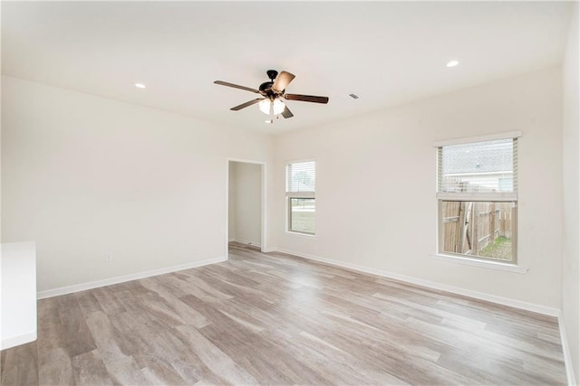 empty room featuring light hardwood / wood-style floors and ceiling fan