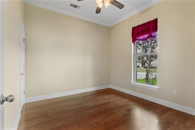 empty room with ceiling fan, ornamental molding, and dark hardwood / wood-style flooring