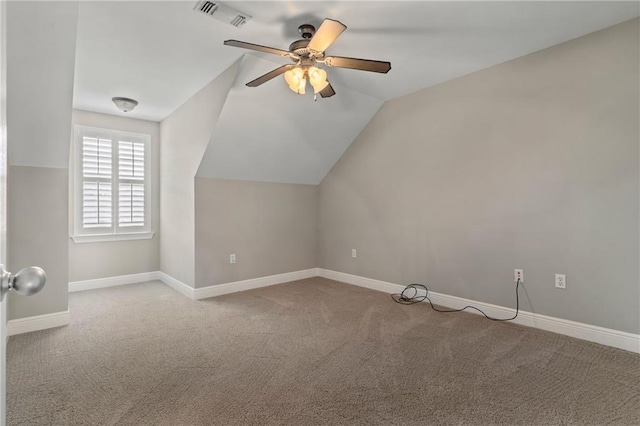 bonus room featuring lofted ceiling, light carpet, and ceiling fan