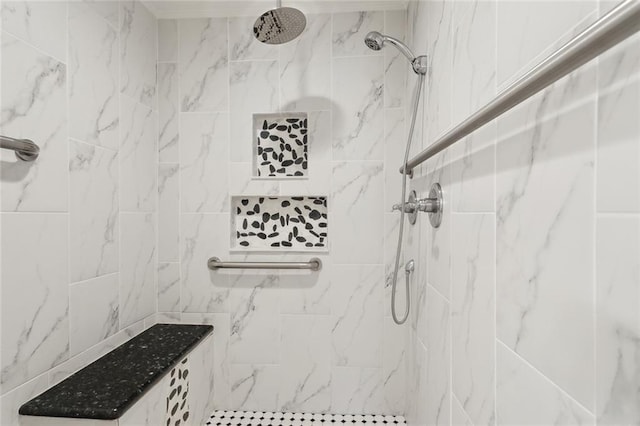 bathroom featuring a tile shower