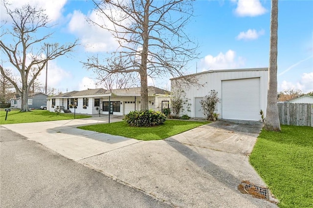 view of front of property featuring a garage and a front yard