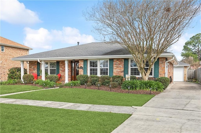 ranch-style home featuring a garage and a front lawn