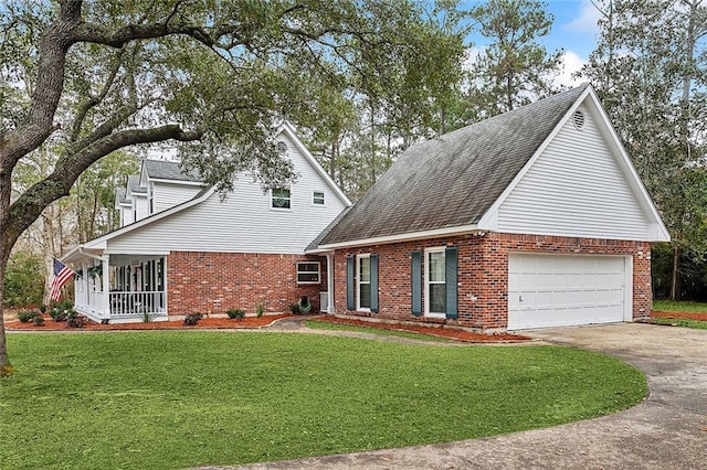 view of front of home with a front yard, driveway, roof with shingles, and brick siding