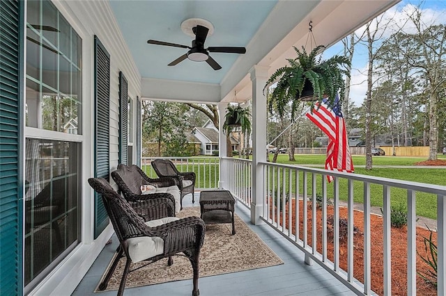 sunroom with a ceiling fan