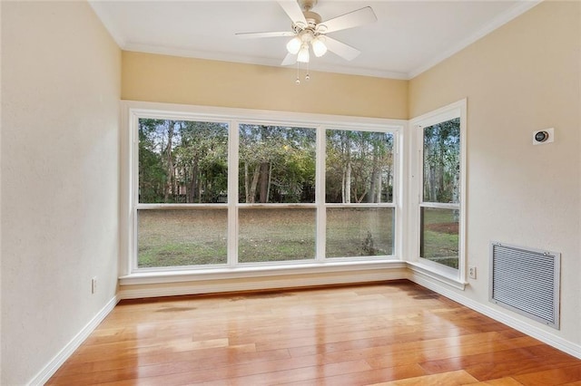 unfurnished sunroom featuring visible vents