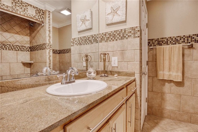 bathroom featuring ornamental molding, tile walls, and vanity