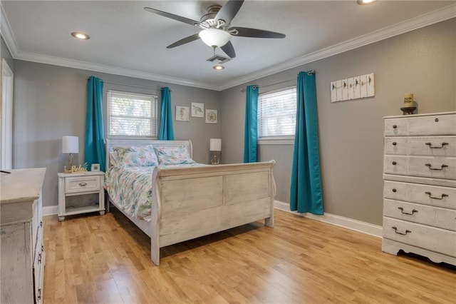 bedroom with ceiling fan, ornamental molding, multiple windows, and light hardwood / wood-style flooring