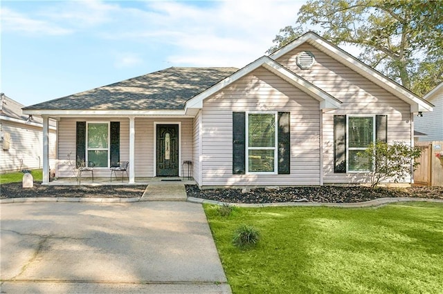 view of front of house featuring a front yard and covered porch