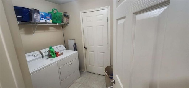 washroom featuring light tile patterned flooring and separate washer and dryer