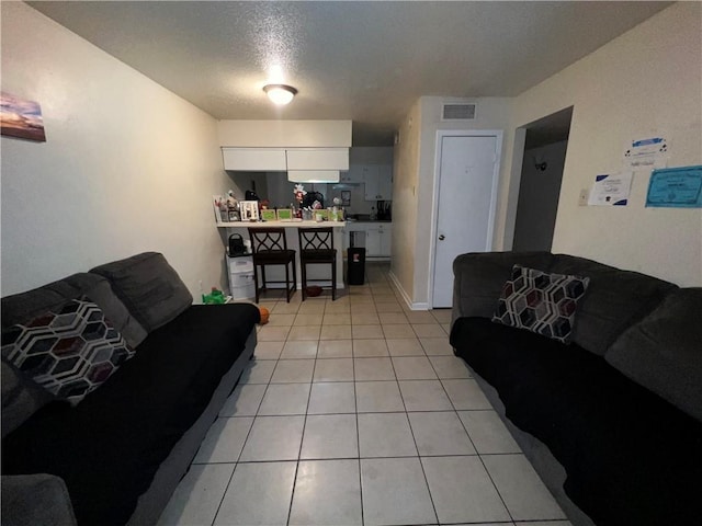 332022 Kabel Dr, New Orleans, LA 70131 - living area featuring light tile patterned floors and a textured ceiling