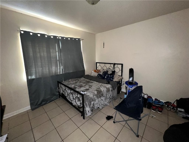 bedroom with light tile patterned floors