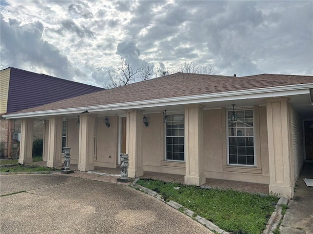 single story home featuring covered porch