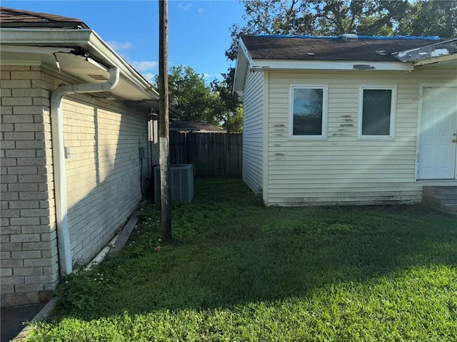 7540 Fieldston Rd, New Orleans, LA 70126 - view of side of home featuring cooling unit, brick siding, and entry steps