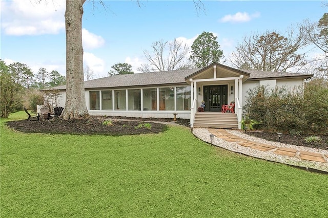 ranch-style home featuring a front yard