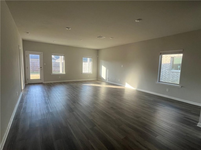 empty room featuring dark wood-type flooring