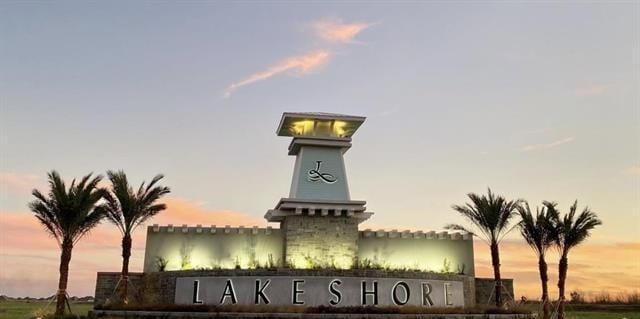 view of outdoor building at dusk